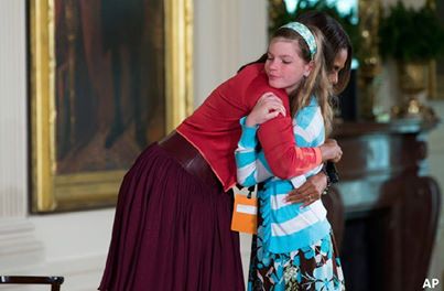 Ten-year-old Charlotte Bell used an event hosted by Michelle Obama to try and find work for her unemployed father. The exchange happened during an annual question and answer event on Thursday for children of White House employees. Charlotte walked up to the US first lady and said "my dad's been out of a job for three years and I wanted to give you his resume". Mrs. Obama then hugged the girl and promised to deal with the matter later.